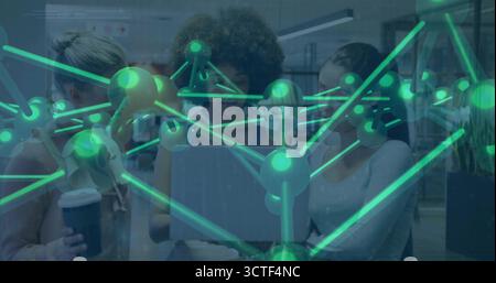 Collaborating professionals examining 3D green network on laptop screen in office, with coffee cup Stock Photo