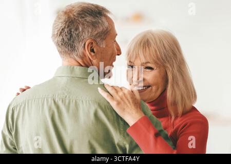 Loving Older Couple Dancing Celebrating Anniversary At Home Stock Photo