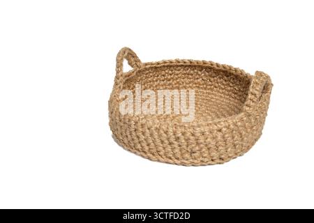 Handwoven brown rope basket with handles on isolated white background. Close up of jute fiber basket Stock Photo