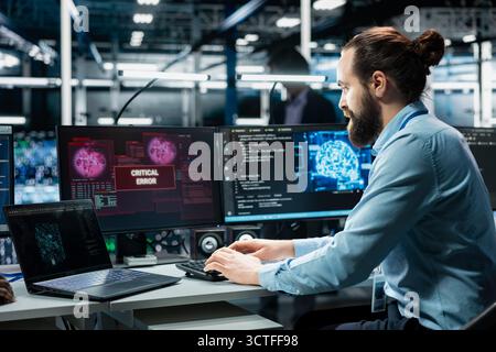 Data center programmer struggling to fix malfunctions while using AI tools. Server hub worker receiving critical error while using artificial intelligence to optimize system health Stock Photo