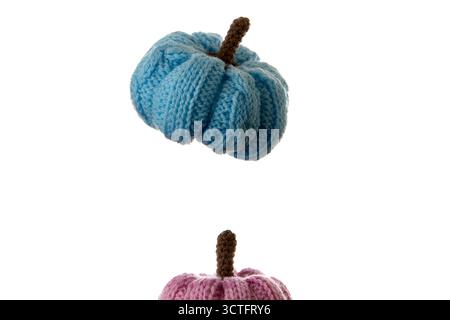 A handmade blue knitted pumpkin isolated on white background, photographed with soft light. Perfect for cozy fall decoration, DIY projects, and craft- Stock Photo
