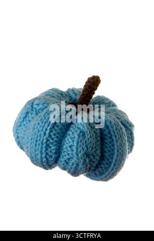 Close up view of a handmade blue knitted pumpkin isolated on white background. Perfect for creative DIY projects, fall decorations, or craft product p Stock Photo