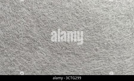 Fine Detailed Close-Up of Grey Non-Woven Felt Fabric Textile Texture for Background and Design Stock Photo