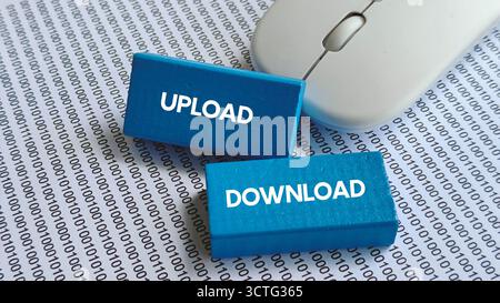 Upload and Download Text on Blue Blocks with Binary Code and Computer Mouse Representing Data Transfer and Internet Activity Stock Photo
