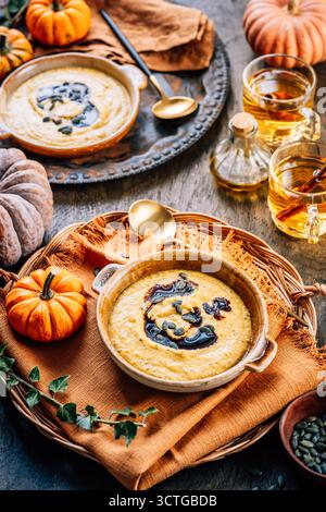 Warm vegan pumpkin soup with pumpkin seeds and coconut milk Stock Photo