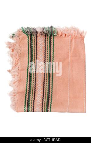 Folded embroidered napkin with fringes isolated on white background Stock Photo
