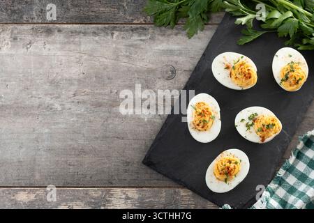 Homemade deviled eggs on wooden table Stock Photo