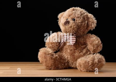 Vermont vintage teddy bear plush toy for kids, gifts and home decor isolated on black background Stock Photo