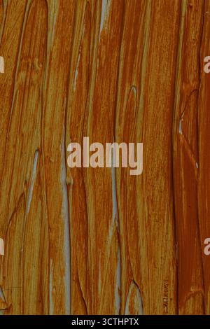 Abstract brown orange paint strokes creating a textured background with vertical lines and brush marks Stock Photo