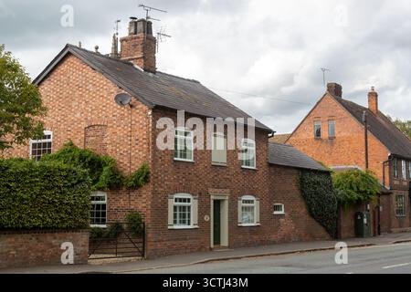 Traditional red brick building in the small Cheshire village of Acton, Cheshire, England Stock Photo