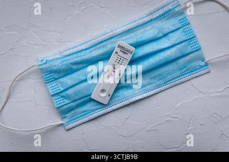 SARS-CoV-2 rapid antigen test with two colored lines - positive result of coronavirus infection Stock Photo
