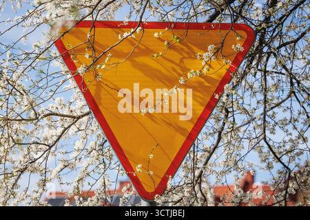 Yield road sign on a street in Warsaw, Poland Stock Photo