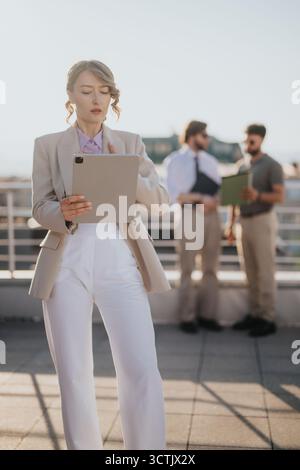 Professional business interaction on a rooftop during the golden hour Stock Photo