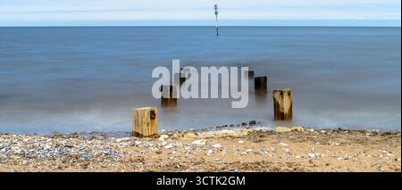 The sea defence gryones at Hunstanton in Norfolk seen at high tide using long exposure. Taken 14th June 2021. Stock Photo
