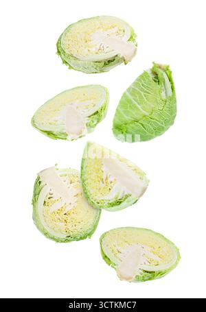 Fresh Savoy cabbage flying in air against white background Stock Photo