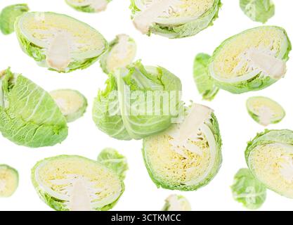Fresh Savoy cabbage flying in air against white background Stock Photo