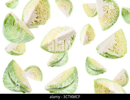 Fresh Savoy cabbage flying in air against white background Stock Photo
