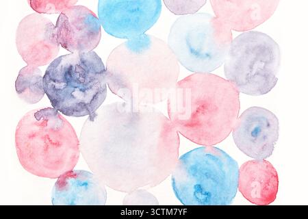 Abstract watercolor circles in pastel pink, blue, and purple shades on white background. Stock Photo