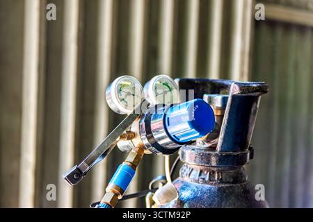 oxygen tube for welding with gauge regulator and flashback arrestor, liquid gas Stock Photo