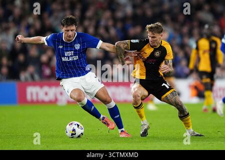 Cardiff City's William Fish (left) scores their side's second goal of the game during the
