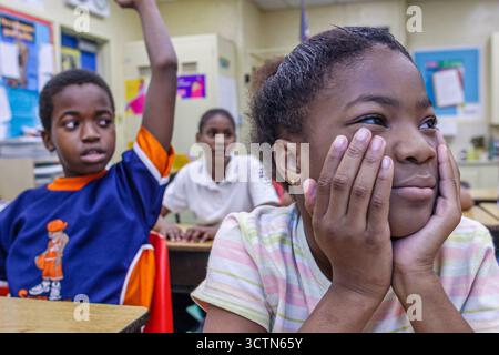 Miami Florida,Overtown,Frederick Douglass Elementary School,Black African student students boy boys girl girls,American Americans class classroom look Stock Photo