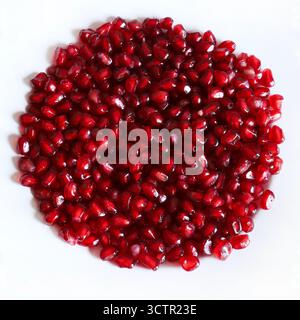 Pomegranate seeds on a white background. Healthy food. Directly above. Stock Photo