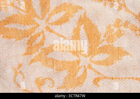 Yellow floral printed fabric closeup as a background Stock Photo