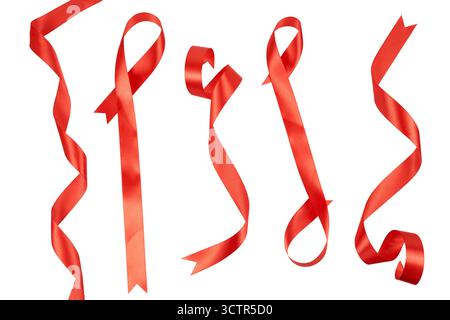 collection of elegant red satin ribbon band and strings laying curly and wavy in different shapes isolated on white Stock Photo