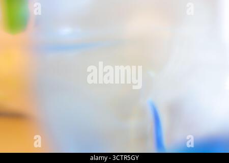 A blurred absract image. The background is softly out of focus, creating a dreamy effect. white, blue and orange colors Stock Photo