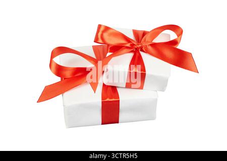stack of white christmas gift boxes with red ribbon bow isolated on white Stock Photo