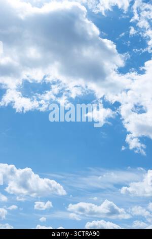 Blue sky with scattered white clouds on a bright day symbolizing freedom and tranquility Stock Photo