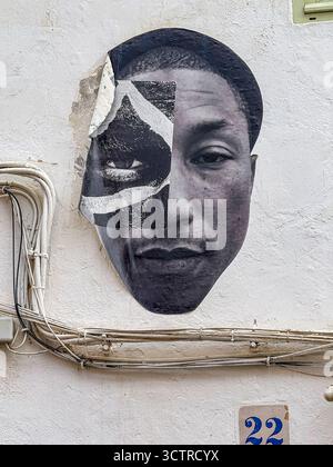 Paste-Up Street Art Portrait of Pharrell Williams on Whitewashed Wall, Dalt Vila, Ibiza, Spain: Phillip Roberts Stock Photo