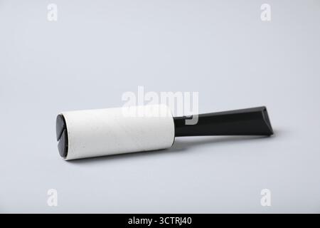 One lint roller on light grey background Stock Photo