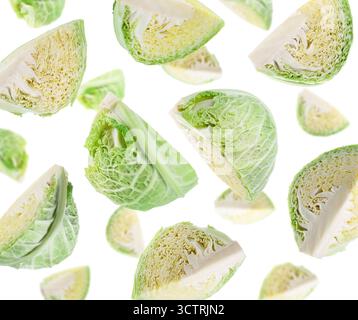 Fresh Savoy cabbage flying in air against white background Stock Photo
