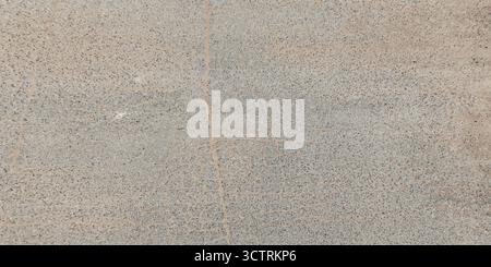 view from above on texture of asphalt road surface with cracks Stock Photo