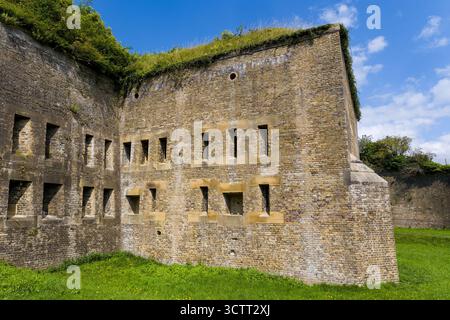 Napoleonic and Victorian era fortifications overgrown with grass on a sunny day. Stock Photo