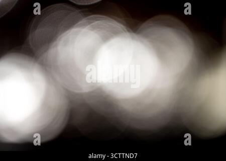 Abstract bokeh background of blurred lights macro photo of glitter dust close up Shot on a Sony a6700 camera with a 100mm macro lens Stock Photo