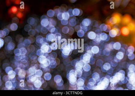 Defocused blue bokeh on dark background — warm abstract blurred lights, ideal for wallpaper and backdrop Stock Photo