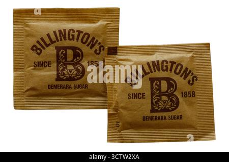 Two sachets of Billingtons Demerara Sugar isolated on white background Stock Photo