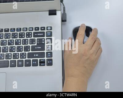Image showing hand using a wireless mouse Stock Photo