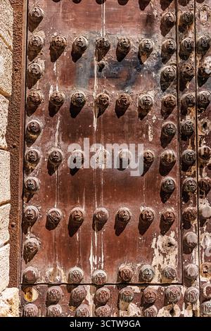 A very old wooden door on the streets of Cadiz Spain. Stock Photo
