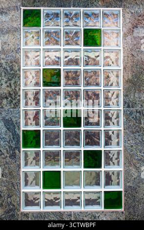 Window glass blocks installed on the wall in the window opening. Stock Photo