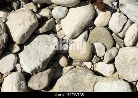 Smooth Natural Stones near Mountain River. Eco Friendly Background with Organic Texture Stock Photo