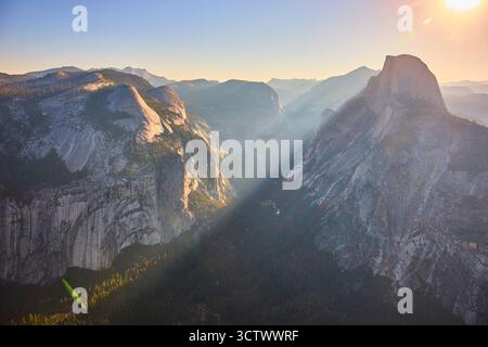 Half Dome Sunrise Sunbeam Over Yosemite Valley from Glacier Point California Stock Photo