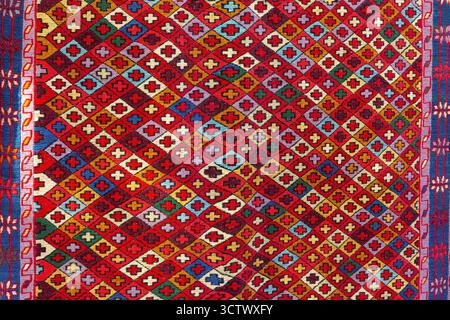 Colorful handmade Georgian carpet with geometric motifs photographed in Tbilisi, Georgia Stock Photo