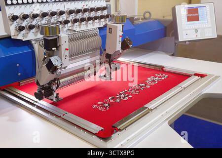 Automatic embroidery machine in the home textile industry. Garment industry Stock Photo