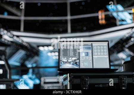 Close up of laptop in spacecraft displaying mission analytics panel with fuel usage, system load and energy efficiency metrics. Notebook screen showing performance indicators for spacecraft resources Stock Photo