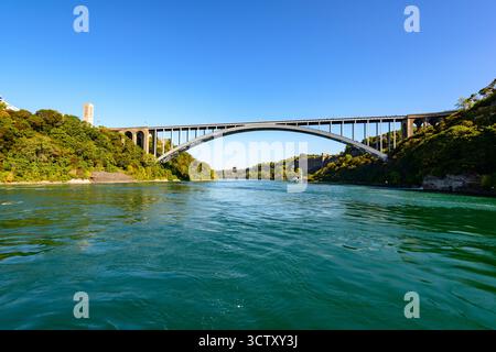 A view of Rainbow Bridge at Niagara Falls from the Niagara River Stock Photo