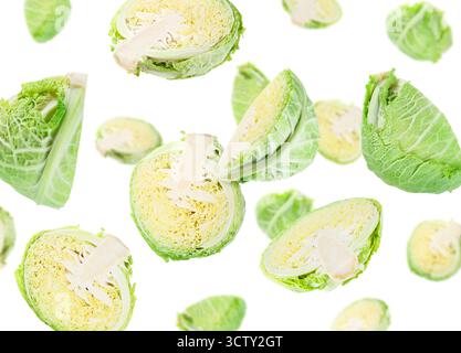 Fresh Savoy cabbage flying in air against white background Stock Photo