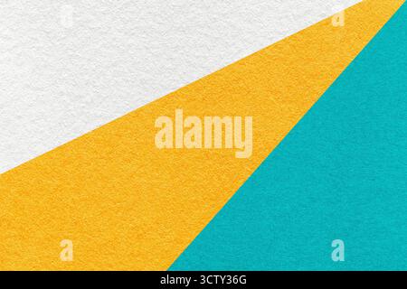 Abstract old geometric paper background with white, yellow and turquoise rays, texture for banner, template. Stock Photo